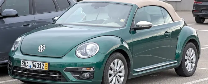 Volkswagen Beetle Cabriolet with its soft-top folded down, showing a classic cabriolet body