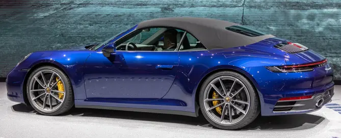 Porsche 911 Cabriolet with the roof open, a convertible you can rent